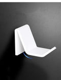 Universal game controller wall mount bracket holding PS5 DualSense controller in black plastic finish