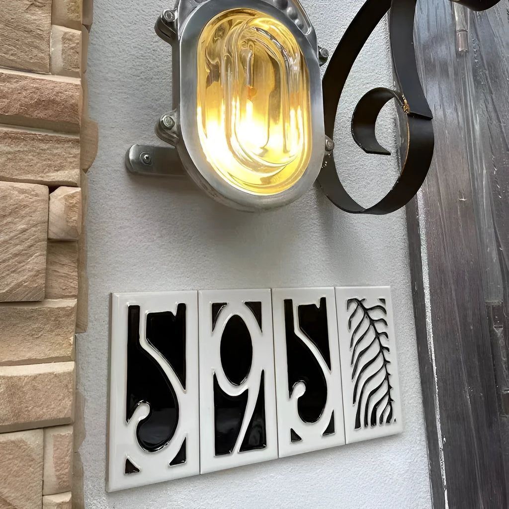 Handmade ceramic door number plaque with retro enamel art design showing style examples