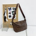 Retro large capacity men's crossbody bag in brown, black, and white PU leather with waterproof feature