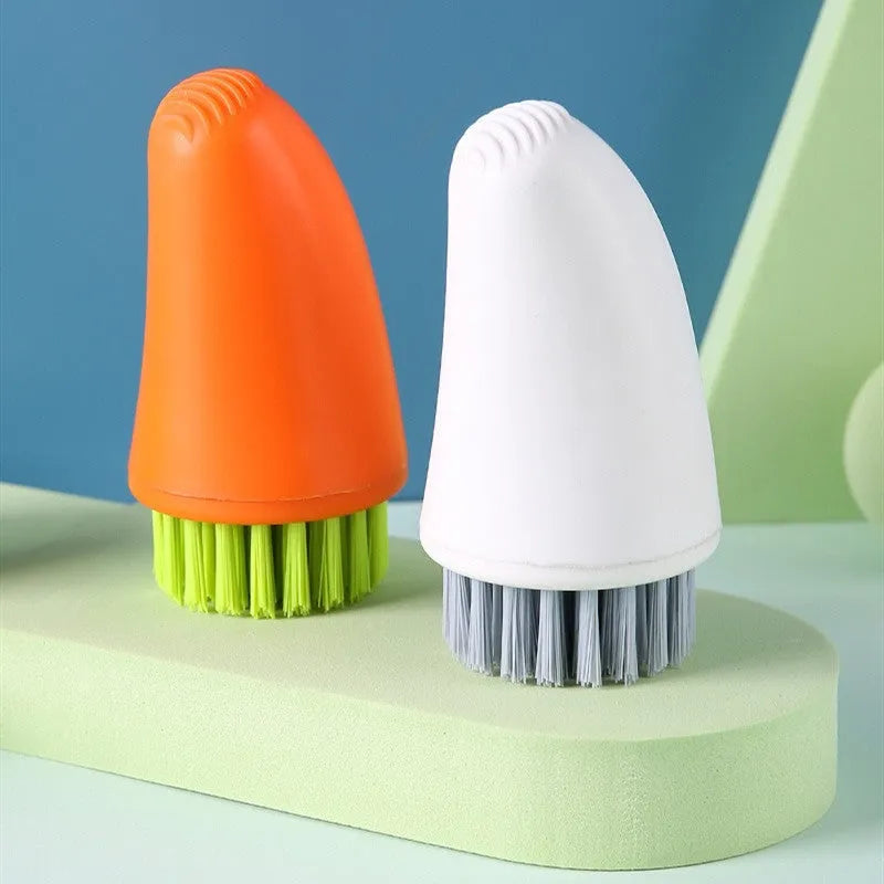 Multifunctional carrot brush with nylon bristles in white and orange for kitchen cleaning