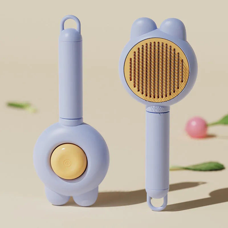 Green self-cleaning pet brush with metal comb and release button on a non-slip handle.