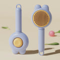 Green self-cleaning pet brush with metal comb and release button on a non-slip handle.