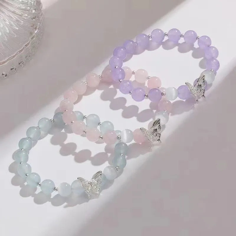 Cat eye crystal bracelet for women, bow shape, pink crystal option, on white background