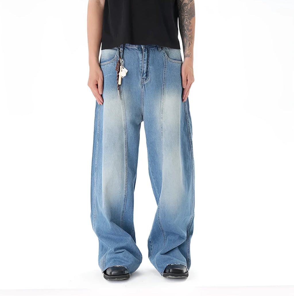 Cut washed vintage washed wide leg machete jeans in light blue denim with zipper fly, front view