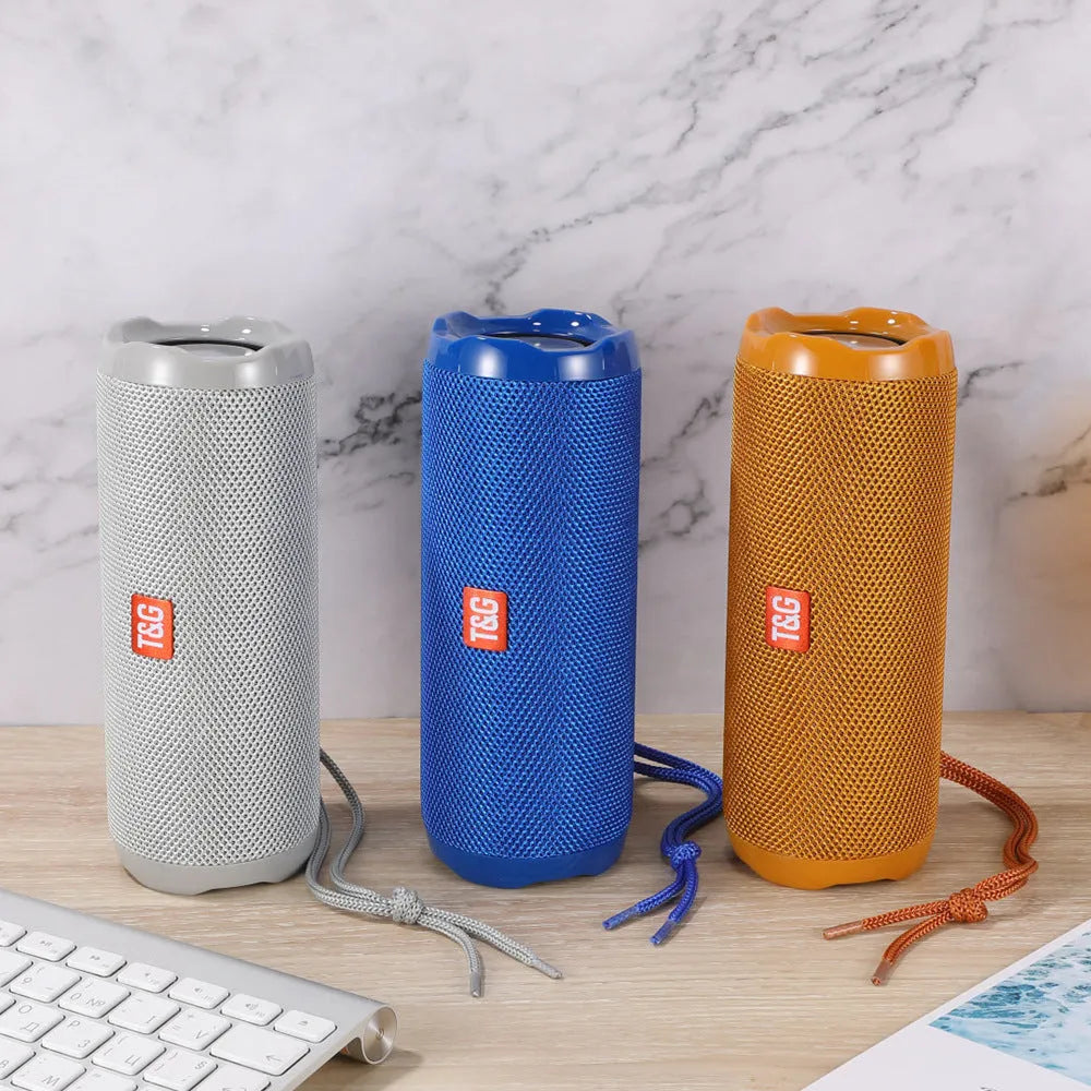 Fabric-covered portable Bluetooth speaker with integrated card holder in multiple colour options
