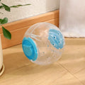 Blue slow feeding ball for cats and small dogs, 11.5cm ABS treat dispenser on floor