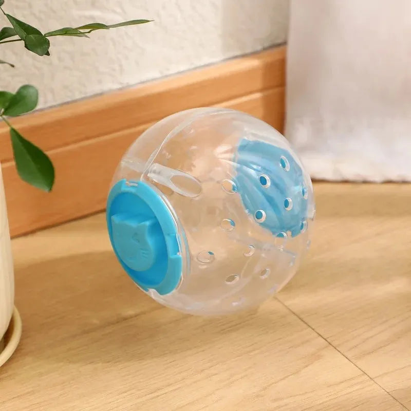 Blue slow feeding ball for cats and small dogs, 11.5cm ABS treat dispenser on floor