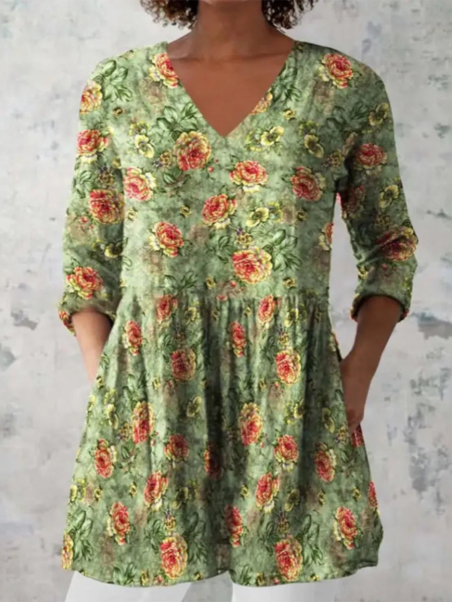 Women's printed loose dress with wide waist and 3/4 length sleeves on a hanger.