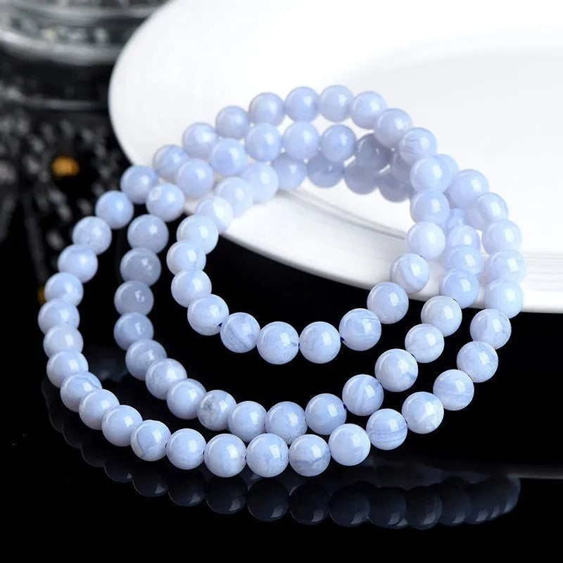 Blue agate multi-circle pattern bead bracelet with original design on a wrist