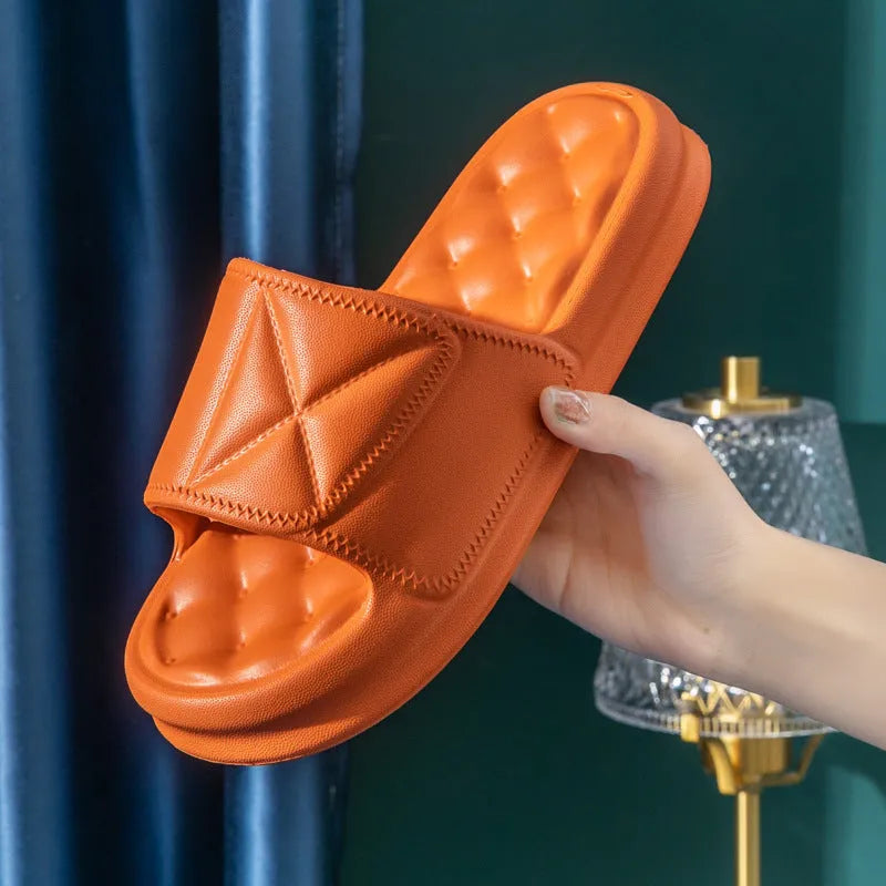 Soft EVA bath slippers in multiple colours showing thick non-slip sole.