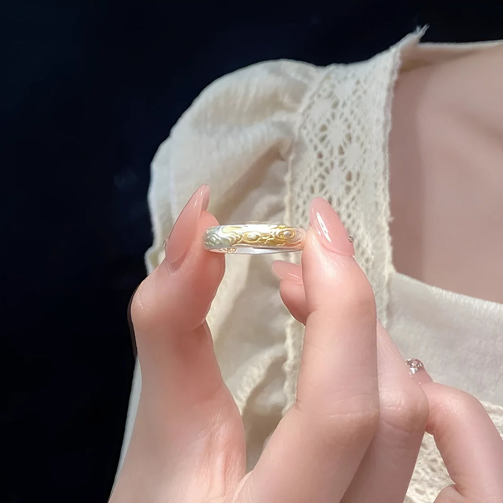 White copper open mouth ring with Xiangyun pattern and silver gold electroplated finish.