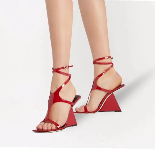 Women's black heel sandals with 9.5cm heel and button fastening, square toe design.