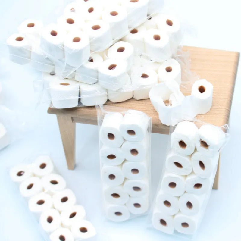 Miniature paper simulated tissue roll model measuring 30x15x80mm for children's pretend play.