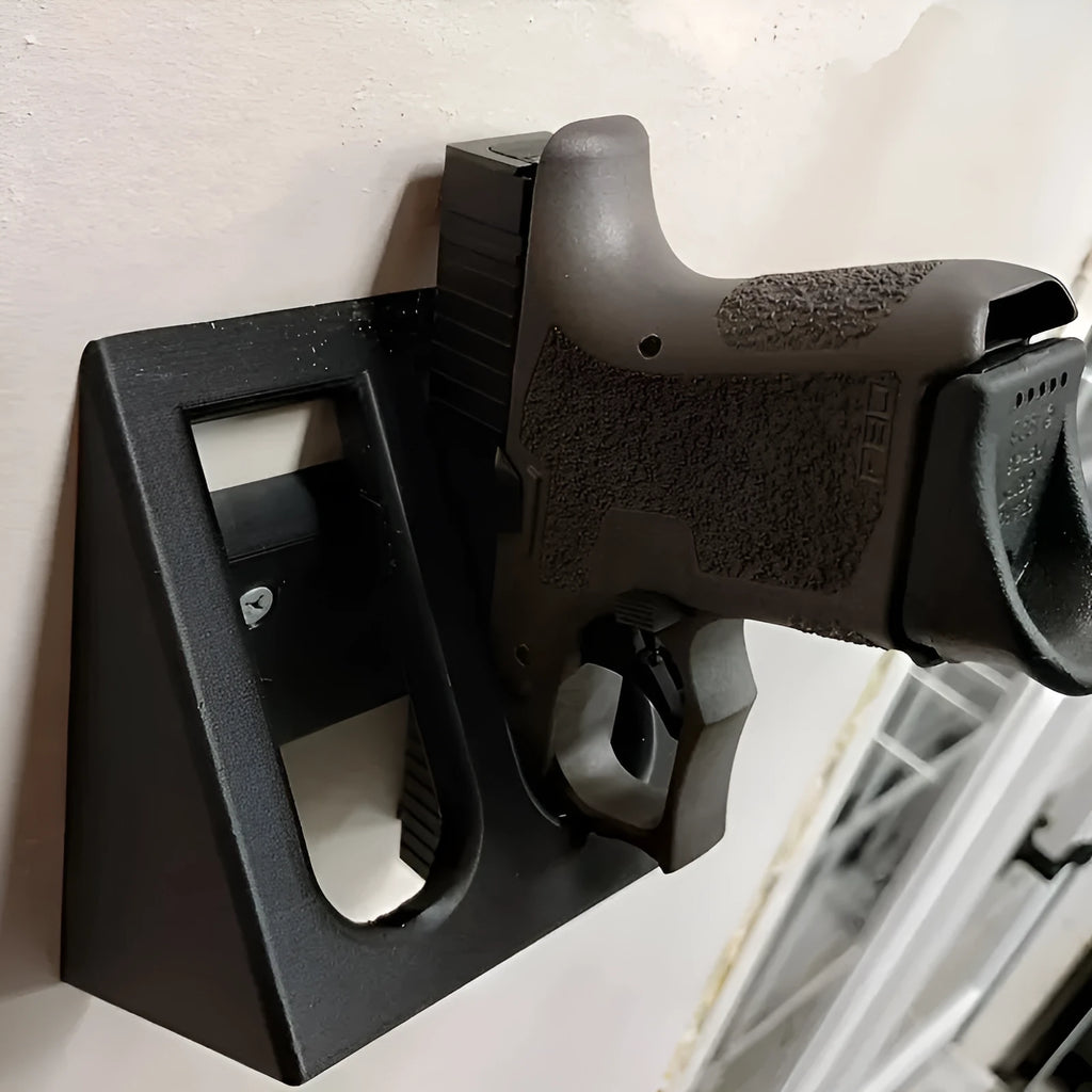 Black punk-style plastic pistol stand for toy gun display.
