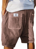 Men's grey corduroy shorts with multiple pockets and an embroidered detail on the leg.