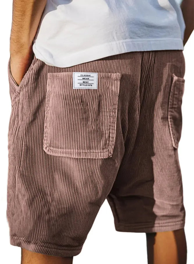 Men's grey corduroy shorts with multiple pockets and an embroidered detail on the leg.