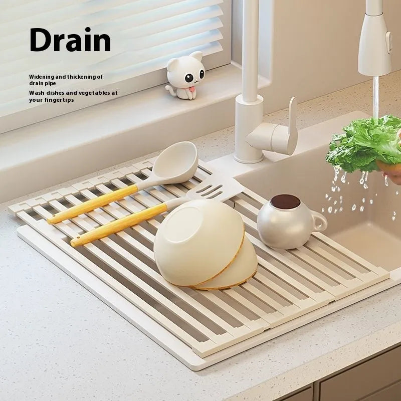 Milky white foldable stainless steel draining rack showing tri-fold design with dishes