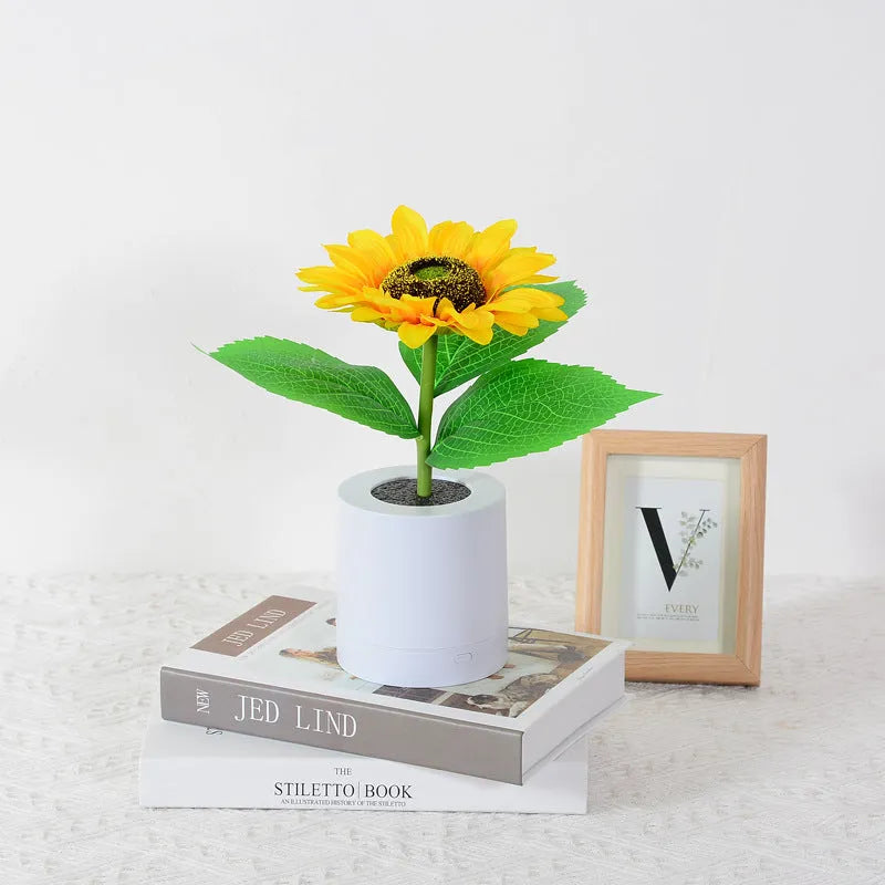 Rechargeable sunflower LED simulation night light with warm glow on a table