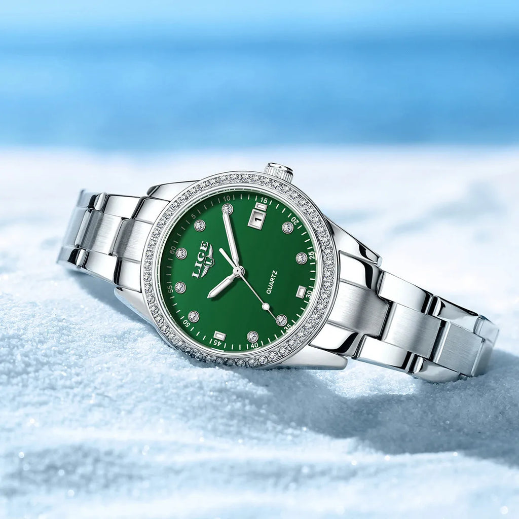 Women's silver tone quartz watch with diamond-encrusted bezel and luminous dial