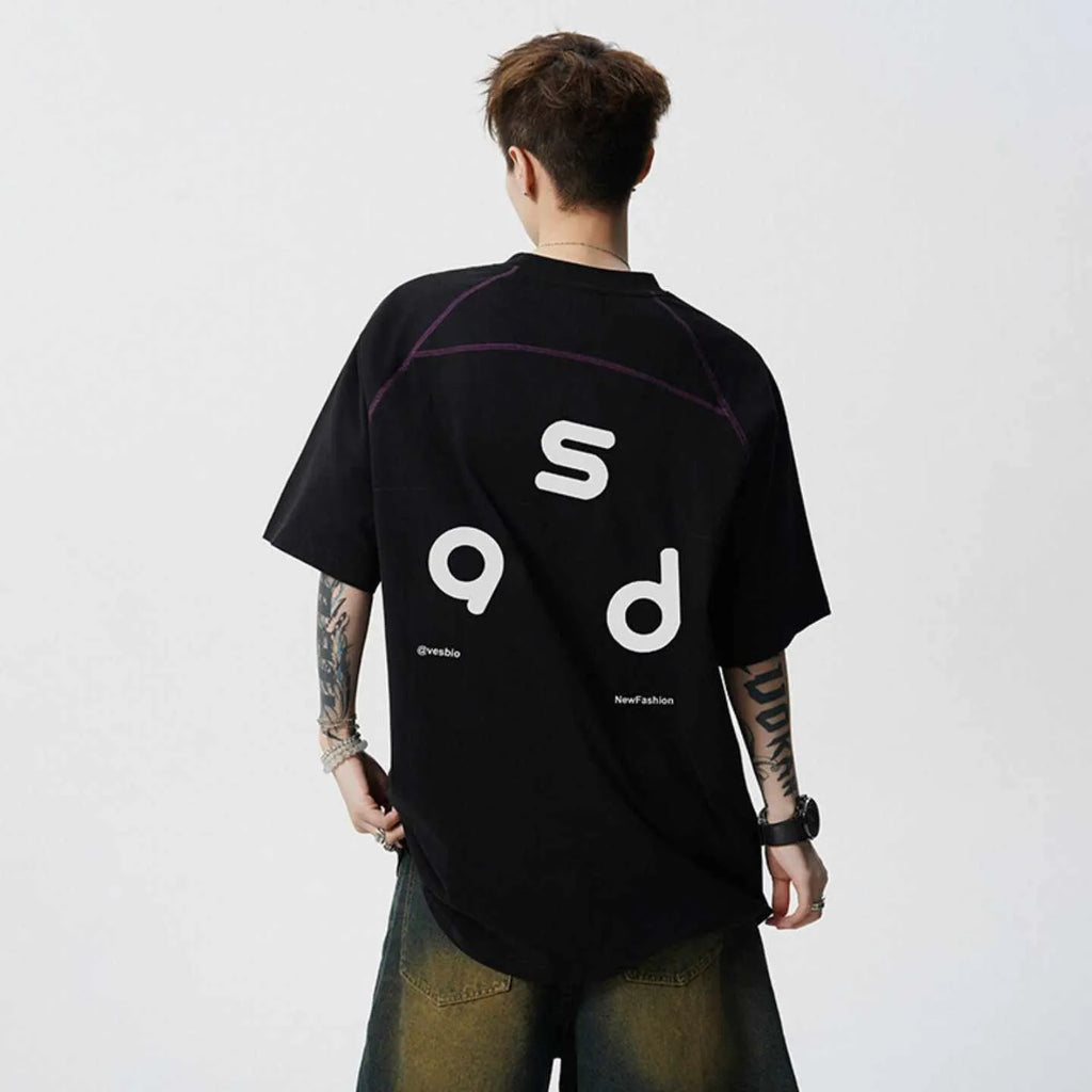Man wearing a black loose-fit cotton short-sleeve T-shirt with a round neck collar.