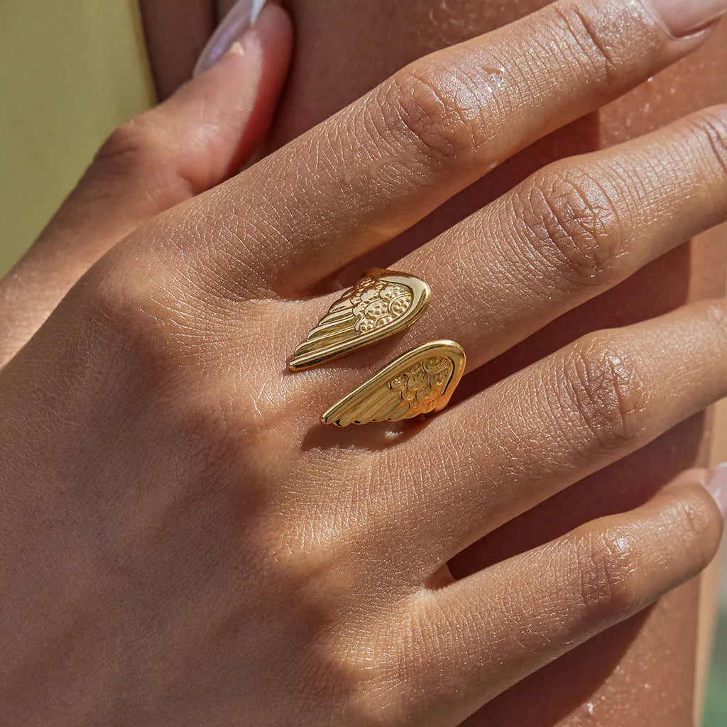 Stainless steel wings motif opening ring with electroplated colour finish