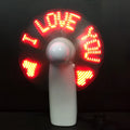 White handheld mini fan with LED flashing I love you pattern in blue and red colours