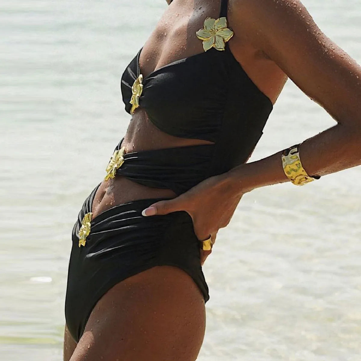 Women's solid colour one-piece swimsuit with hollow-out tube top and separate matching short skirt.