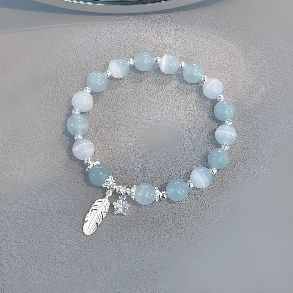 Small white girl crystal bracelet in Feather XINGX Blue Moonlight with eight Awn star and text design