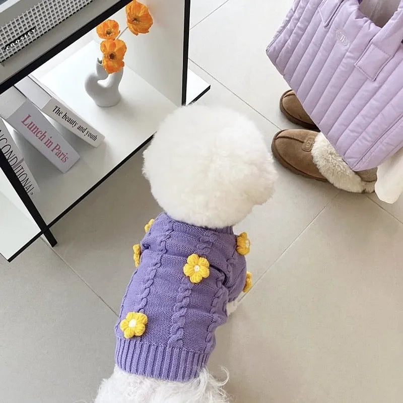 Purple knitted flower print dog clothes with size options from XS to XL on a plain background