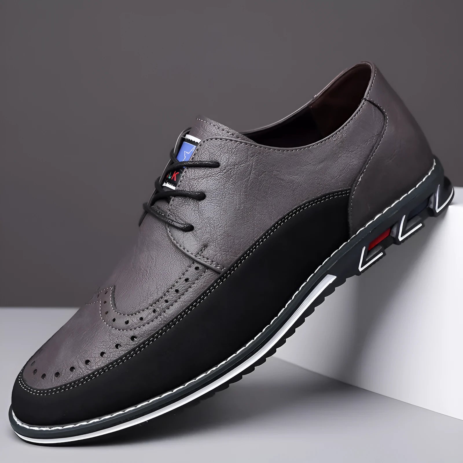 Men's black leather slip-on shoes with rubber sole and decorative sewing lines on fabric upper