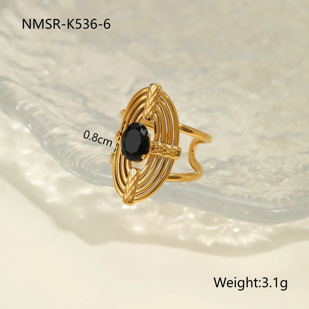 Women's adjustable titanium steel ring with geometric shape and inlaid zircon detailing on a finger.