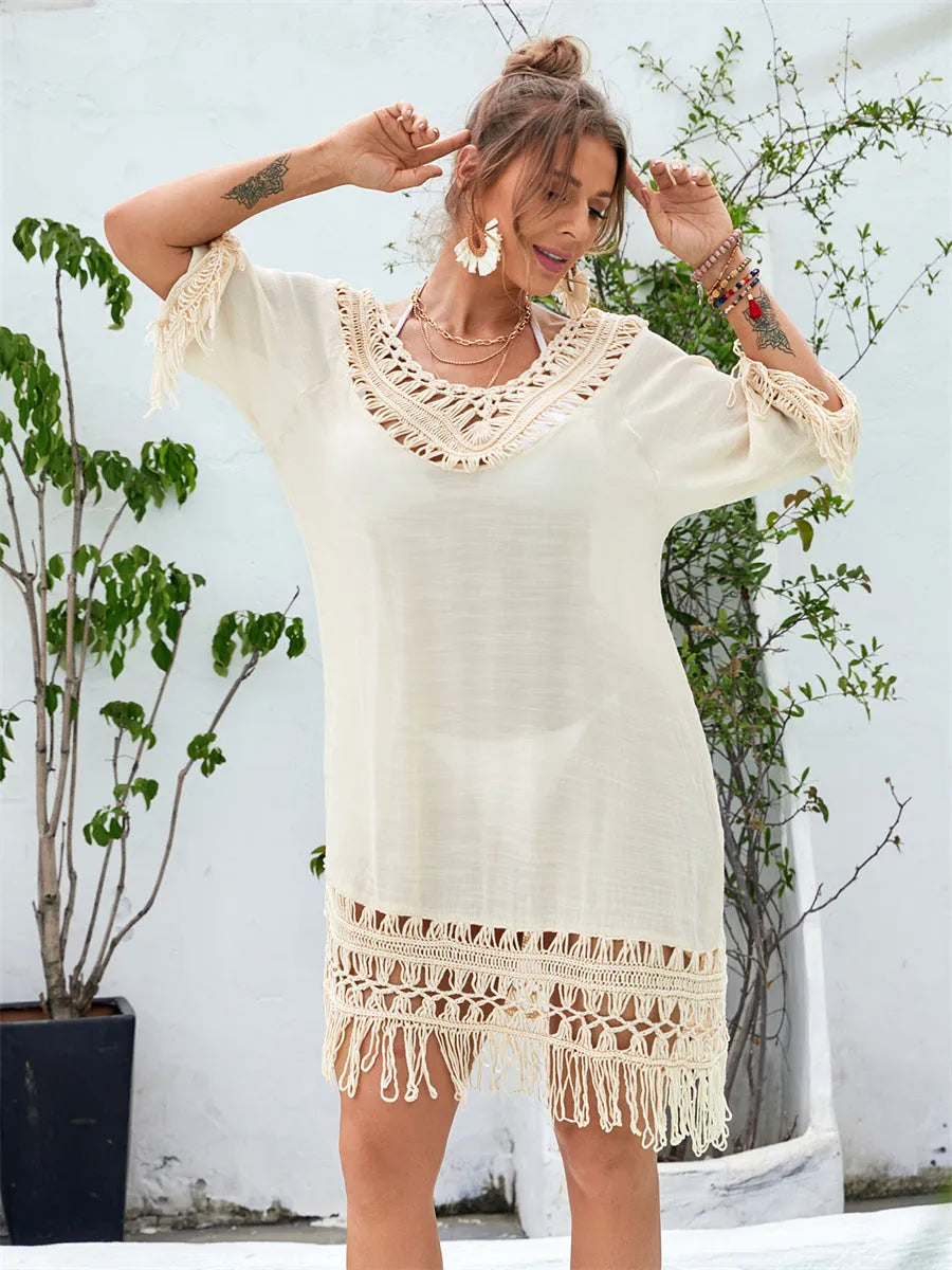 Hand-crocheted apricot-coloured beach dress with a lining, shown as a women's cover-up.