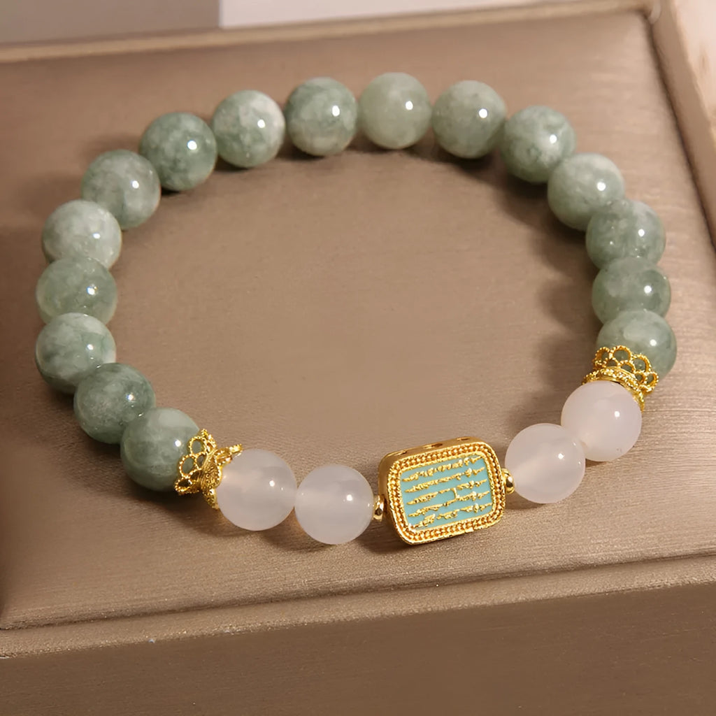 Oil green emerald crystal bracelet with five faceted beads on a string for women.