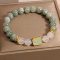 Oil green emerald crystal bracelet with five faceted beads on a string for women.