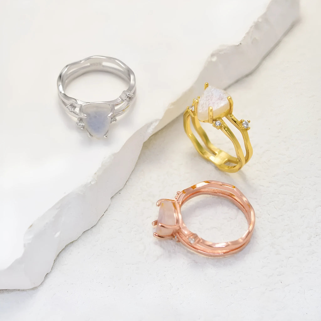S925 silver ring with irregular triangle shape and moonstone in rose, white, or yellow gold finish.