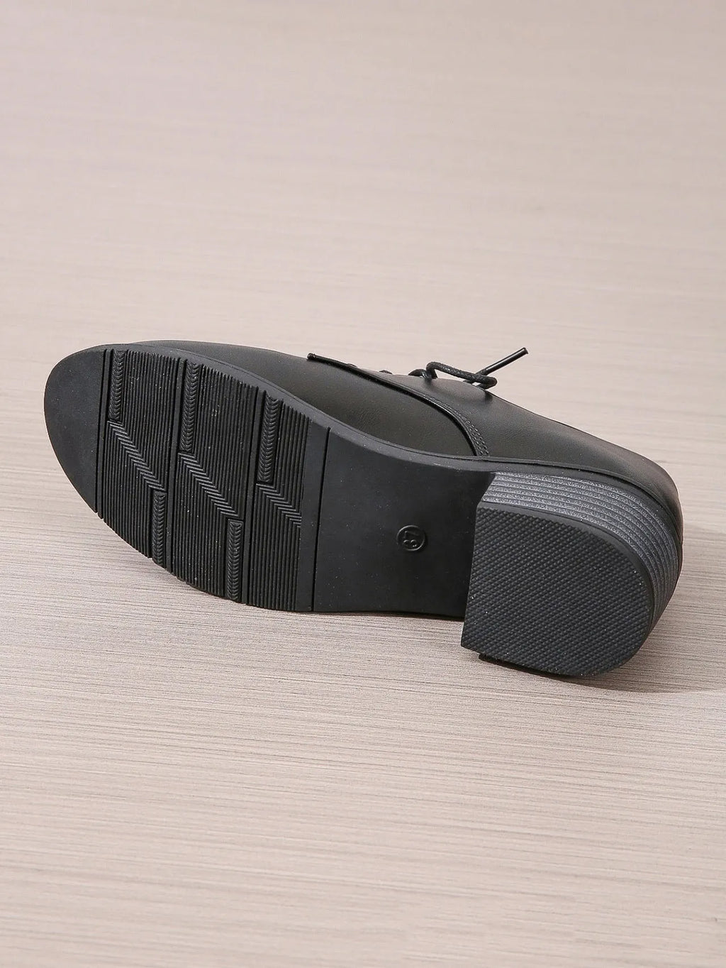 Black women's low-top shoes with a chunky mid-height heel and round toe.