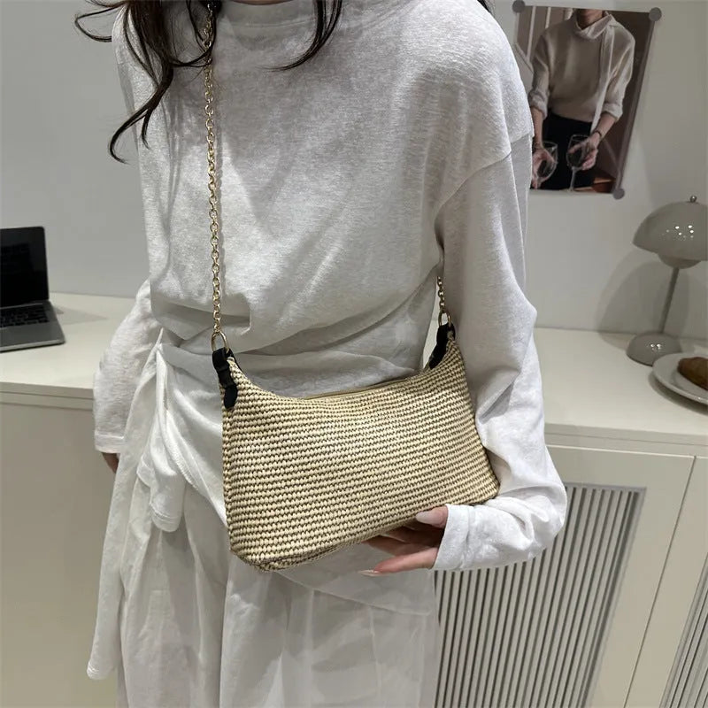 Vacation style straw woven beach shoulder tote bag in horizontal square shape with sandwich pocket