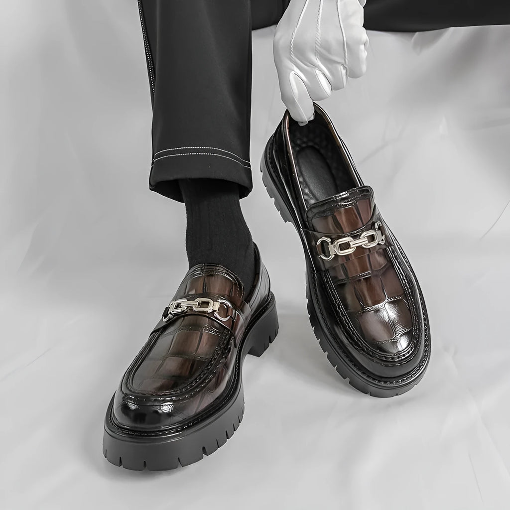 Pair of autumn men's crocodile pattern leather loafers in brown with flat heel platform sole