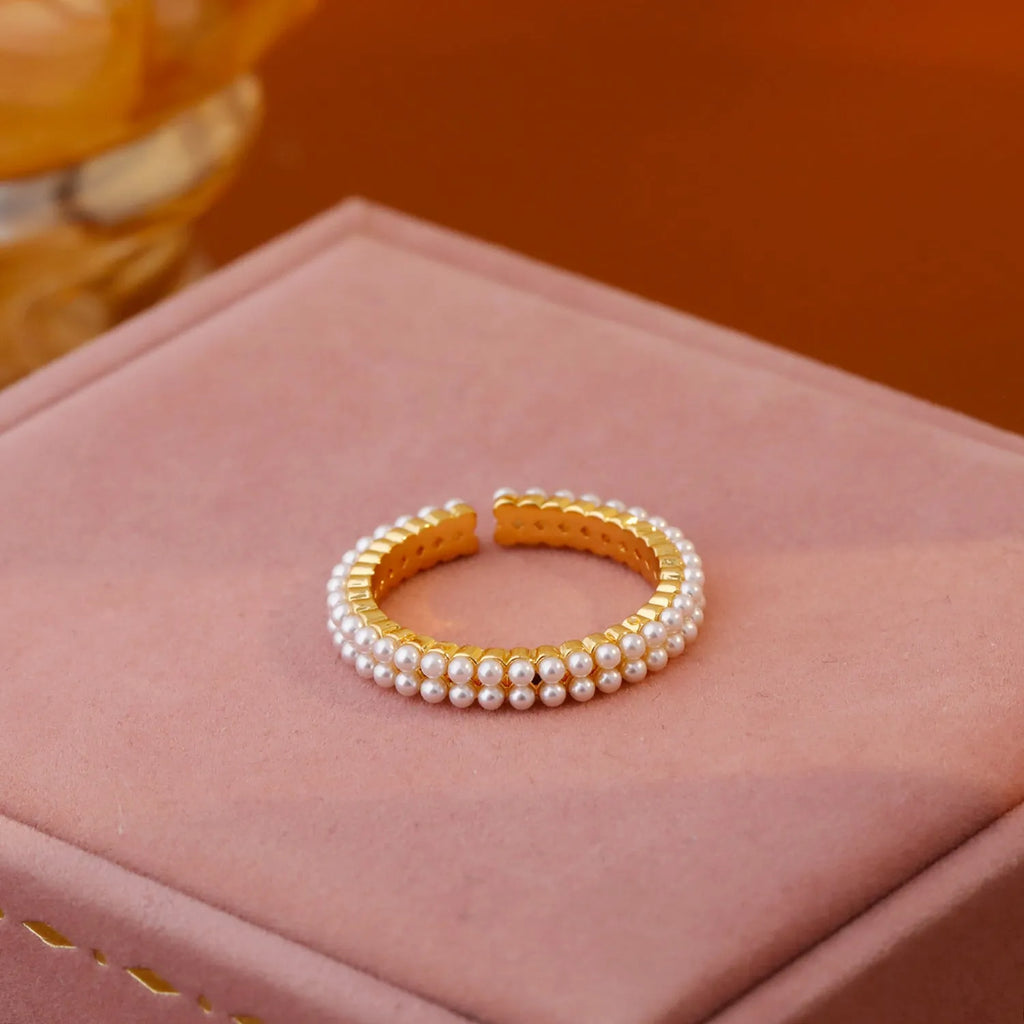 Gold geometric open mouth women's ring with pearl elements on electroplated copper