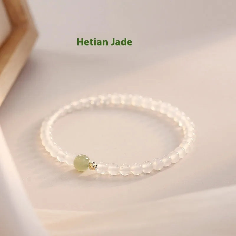 Natural Hetian Jade white agate women's bracelet 15cm on display showing banded white stones
