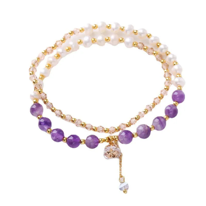 Handmade crystal double ring bracelet with natural freshwater pearl in strawberry quartz colour on wrist
