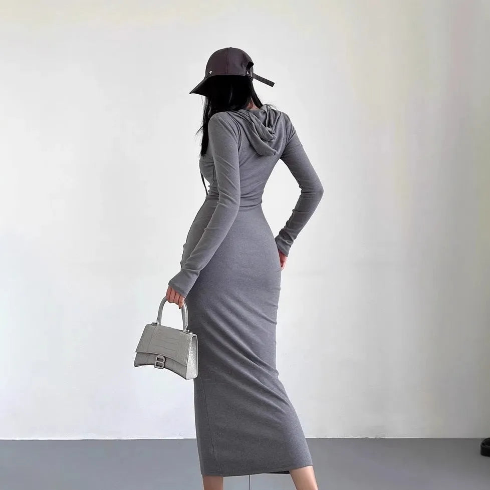 Women's grey hooded long-sleeve sheath dress with a high waist on a model