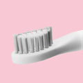 Sonic electric toothbrush with round brush head in blue, IPX7 waterproof handle with power button