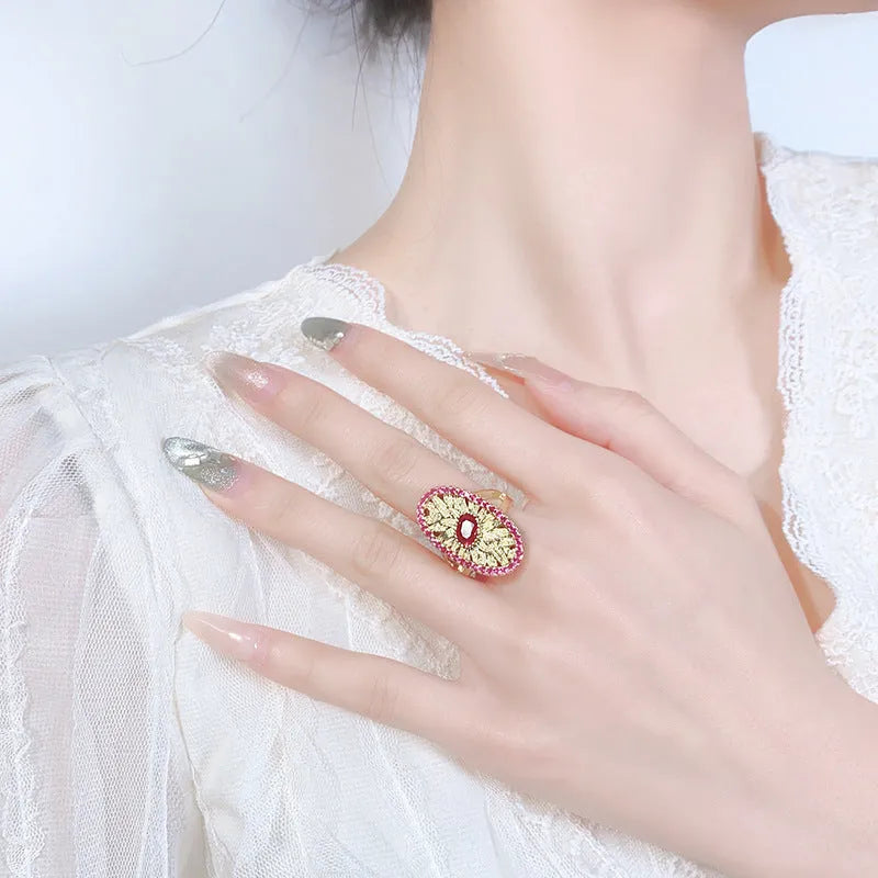 Gold-plated jewellery set with simulated red corundum stones, water drop shape, diamond cut finish, necklace ring ear studs