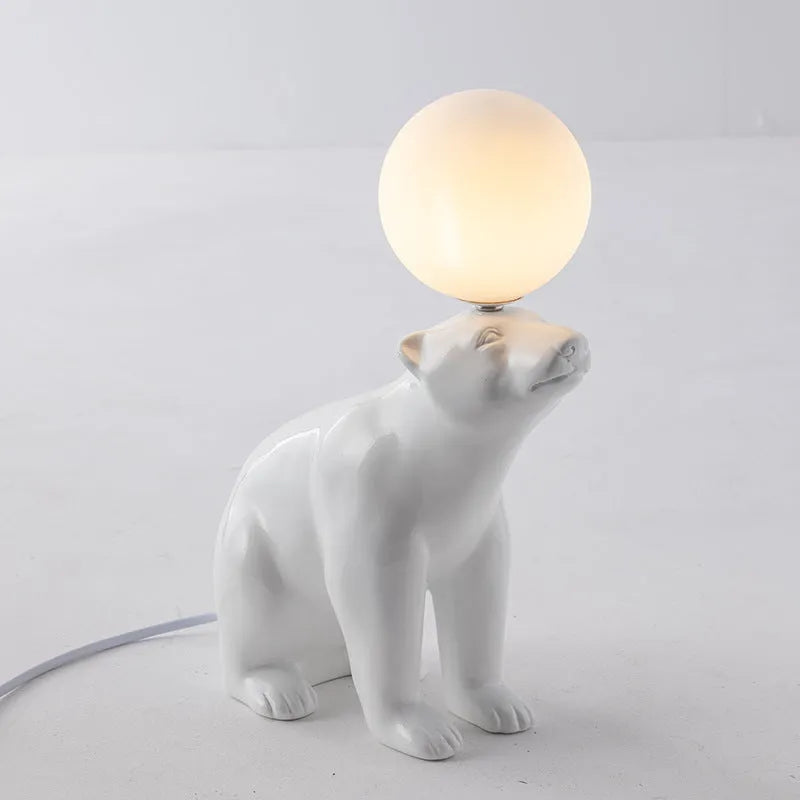 White Nordic style bear table lamp in sitting posture on a bedside table