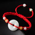 Emerald round jade pendant on adjustable red rope bracelet with certificate