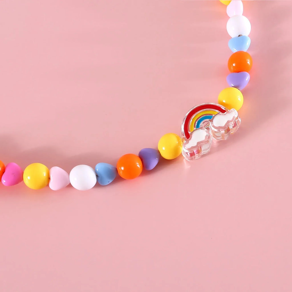 Adjustable plastic cat collar necklace with colourful pearl beads in small flower, rainbow, or peach patterns.