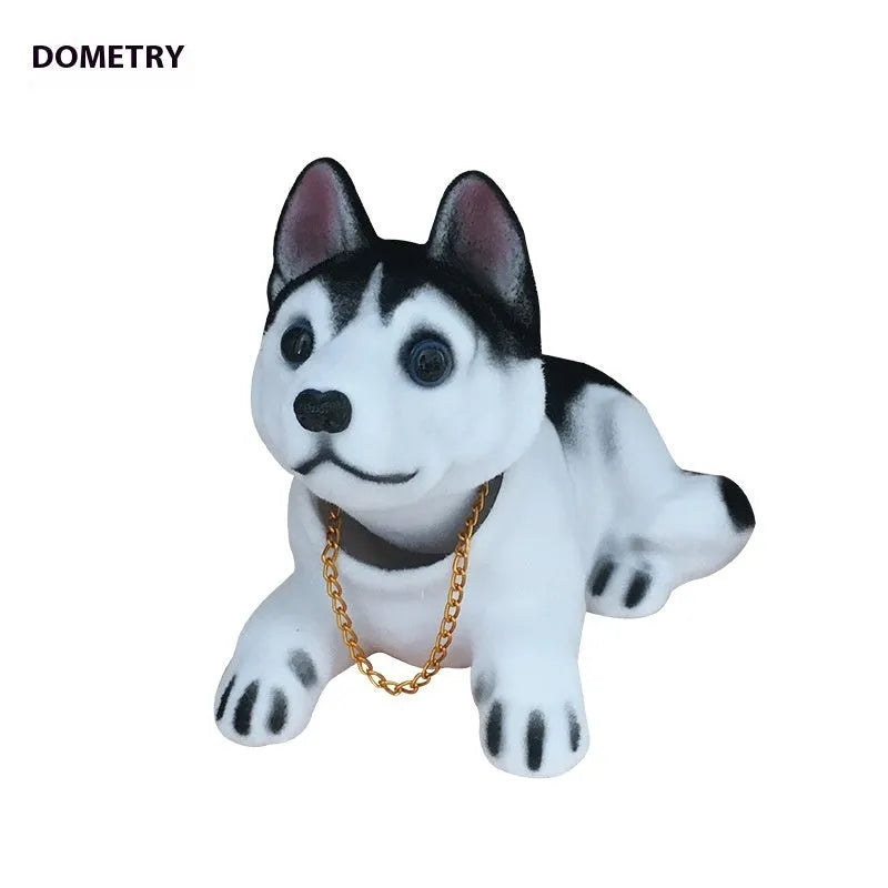 Resin head-shaking dog car decoration in multiple breed colour options on a car dashboard