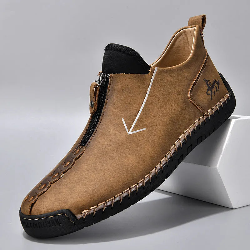 Men's brown leather-look martin boots with a front zipper and round toe on a rubber sole.