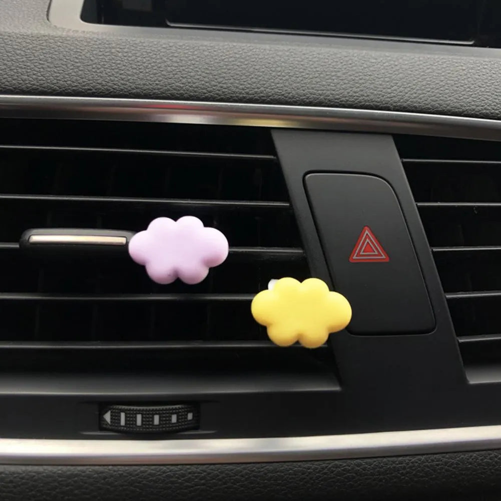 Resin Baiyun cartoon car fragrance clip in light green colour attached to car air vent
